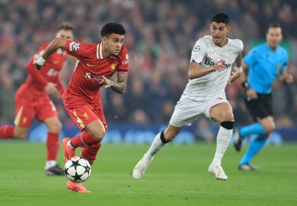5th November 2024; Anfield, Liverpool, Merseyside, England; Champions League Football, Liverpool versus Bayer Leverkusen; Luis Diaz of Liverpool takes on Piero Hincapie of Bayer Leverkeusen  ActionPlus12712380 DavidxBlunsden