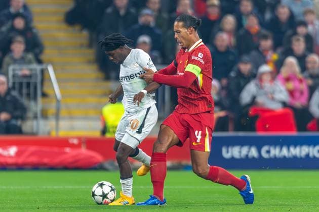 Liverpool v Bayer Leverkusen Champions League 05 11 2024. Liverpool defender Virgil van Dijk (4) tackles Bayer Leverkusen defender Jeremie Frimpong (30) during the Champions League match between Liverpool and Bayer Leverkusen at Anfield, Liverpool, England on 5 November 2024. Editorial use only , Copyright: xIanxStephenx PSI-20755-0007
