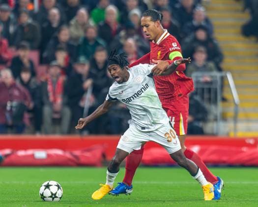 Liverpool v Bayer Leverkusen Champions League 05 11 2024. Liverpool defender Virgil van Dijk (4) tackles Bayer Leverkusen defender Jeremie Frimpong (30) during the Champions League match between Liverpool and Bayer Leverkusen at Anfield, Liverpool, England on 5 November 2024. Editorial use only , Copyright: xIanxStephenx PSI-20755-0009