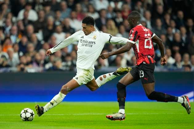 Real Madrid C.F. v AC Milan - UEFA Champions League 2024 25 League Phase MD4 Jude Bellingham central midfield of Real Madrid and England shooting to goal front Fikayo Tomori centre-back of AC Milan and England during the UEFA Champions League 2024 25 League Phase MD4 match between Real Madrid C.F. and AC Milan at Estadio Santiago Bernabeu on November 5, 2024 in Madrid, Spain. Madrid Spain  Copyright: xJosexBretonx originalFilename:bretonhernandez-realmadr241105_npX6b.jpg