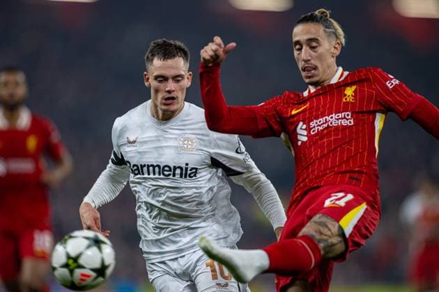 Football - UEFA Champions League - League Phase - Liverpool FC v Bologna FC 1909 LIVERPOOL, ENGLAND - Wednesday, October 2, 2024: Bayer Leverkusen s Florian Wirtz (L) and Liverpool s Kostas Tsimikas during the UEFA Champions League game between Liverpool FC and Bologna FC 1909 at Anfield. (Photo by David Rawcliffe Propaganda) LIVERPOOL Anfield MERSEYSIDE ENGLAND  Copyright: xDavidxRawcliffex P2024-11-05-Liverpool_Leverkusen-25