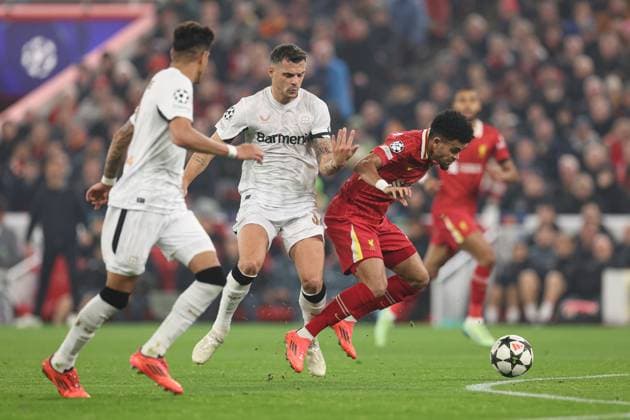 Luis Diaz of Liverpool under pressure from Granit Xhaka of Bayer 04 Leverkusen Liverpool v Bayer 04 Leverkusen, UEFA Champions League, Group Stage, Football, Anfield, Liverpool, UK - 05 Nov 2024 EDITORIAL USE ONLY No use with unauthorised audio, video, data, fixture lists, club league logos or live services. Online in-match use limited to 120 images, no video emulation. No use in betting, games or single club league player publications. Copyright: xPaulxCurrie Shutterstockx 14863785bx