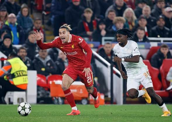 Liverpool FC v Bayer 04 Leverkusen - UEFA Champions League 2024 25 League Phase MD4 Kostas Tsimikas of Liverpool and Jeremie Frimpong of Bayer 04 Leverkusen in action during the UEFA Champions League 2024 25 League Phase MD4 match between Liverpool FC and Bayer 04 Leverkusen at Anfield on November 5, 2024 in Liverpool, England. Liverpool Anfield England United Kingdom Copyright: xRichardxSellers Sportsphoto APLx 14051916