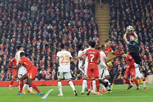 5th November 2024; Anfield, Liverpool, Merseyside, England; Champions League Football, Liverpool versus Bayer Leverkusen; Bayer Leverkeusen goalkeeper Lukas Hradecky leaps to claim a cross  ActionPlus12712421 DavidxBlunsden