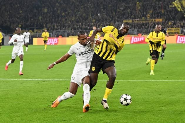 Emanuel Aiwu SK Sturm Graz and Serhou Guirassy Borussia Dortmund in a duel during the UEFA Champions League 2024 25 League Phase 4 matchday match between Borussia Dortmund and SK Sturm Graz, SIGNAL IDUNA PARK on November 05, 2024 in Dortmund, Germany, Germany Photo by Ralf Treese DeFodi Images Emanuel Aiwu SK Sturm Graz and Serhou Guirassy Borussia Dortmund in a duel during the UEFA Champions League 2024 25 League Phase MD4 match between Borussia Dortmund and SK Sturm Graz at Signal Iduna Park on November 5, 2024 in Dortmund, Germany not used in POL SRB CRO FRA GBR NED ITA USA Defodi 521 BVBGRA20241105 020 Defodi-521 not used in POL SRB CRO FRA GBR NED ITA USA