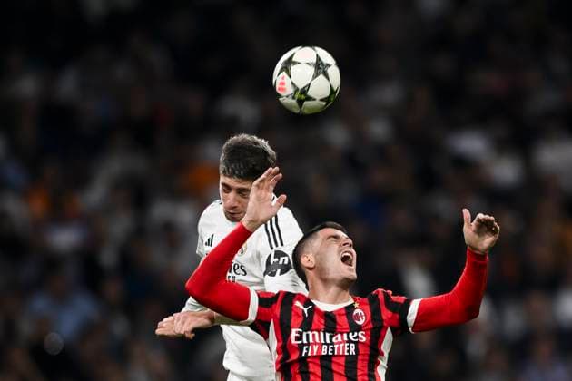 Real Madrid CF v AC Milan - UEFA Champions League Alvaro Morata of AC Milan competes for a header with Federico Valverde of Real Madrid CF during the UEFA Champions League 2024 25 league phase football match between Real Madrid CF and AC Milan. Madrid Spain Copyright: xNicolòxCampox