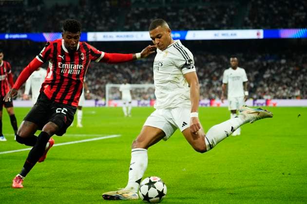 Real Madrid C.F. v AC Milan - UEFA Champions League 2024 25 League Phase MD4 Kylian Mbappe centre-forward of Real Madrid and France and Emerson Royal right-back of AC Milan and Brazil compete for the ball during the UEFA Champions League 2024 25 League Phase MD4 match between Real Madrid C.F. and AC Milan at Estadio Santiago Bernabeu on November 5, 2024 in Madrid, Spain. Madrid Spain  Copyright: xJosexBretonx originalFilename:bretonhernandez-realmadr241105_np4dT.jpg