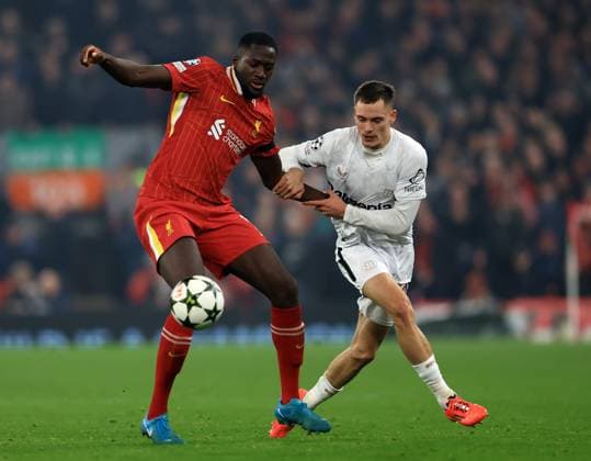 Liverpool, England, 5th November 2024. Ibrahima Konate of Liverpool with Florian Wirtz of Bayer Leverkusen during the UEFA Champions League match at Anfield, Liverpool. Picture credit should read: Jessica Hornby Sportimage EDITORIAL USE ONLY. No use with unauthorised audio, video, data, fixture lists, club league logos or live services. Online in-match use limited to 120 images, no video emulation. No use in betting, games or single club league player publications. SPI-3439-0068