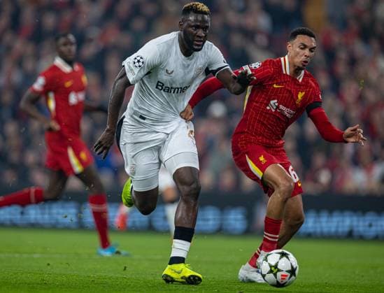 Football - UEFA Champions League - League Phase - Liverpool FC v Bayer Leverkusen LIVERPOOL, ENGLAND - Tuesday, November 5, 2024: Bayer Leverkusen s Victor Boniface (L) is challenged by Liverpool s Trent Alexander-Arnold during the UEFA Champions League game between Liverpool FC and Bayer Leverkusen at Anfield. (Photo by David Rawcliffe Propaganda) LIVERPOOL Anfield MERSEYSIDE ENGLAND  Copyright: xDavidxRawcliffex P2024-11-05-Liverpool_Leverkusen-12