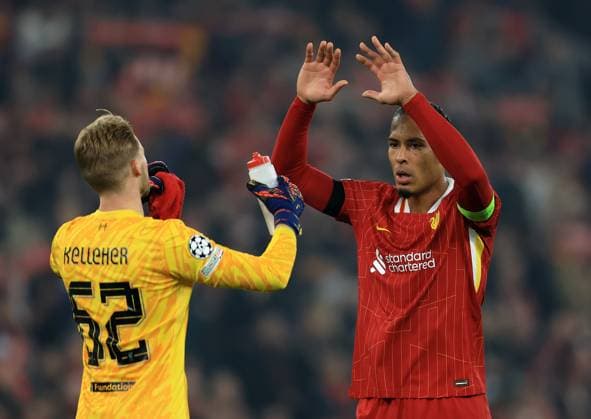 Liverpool, England, 5th November 2024. Virgil van Dijk of Liverpool celebrates with Caoimhin Kelleher of Liverpool during the UEFA Champions League match at Anfield, Liverpool. Picture credit should read: Jessica Hornby Sportimage EDITORIAL USE ONLY. No use with unauthorised audio, video, data, fixture lists, club league logos or live services. Online in-match use limited to 120 images, no video emulation. No use in betting, games or single club league player publications. SPI-3439-0088