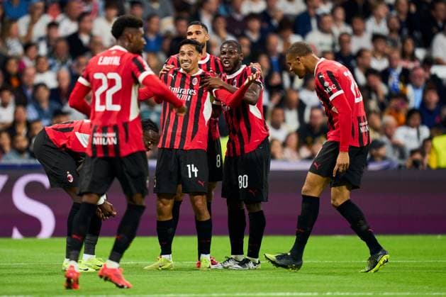 Tijjani Reijnders of AC Milan celebrates with is teammates after scoring the 1-3 Real Madrid v AC Milan, UEFA Champios League match, date 4. Football, Santiago Bernabeu Stadium, Madrid, Spain - 5 Nov 2024 Editorial use only  Copyright: xPressinphoto Shutterstockx 14869602be