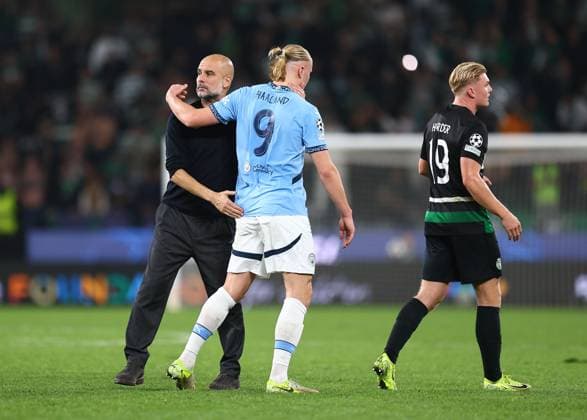 Josep Guardiola manager of Manchester City and Erling Haaland of Manchester City after the match Sporting Lisbon v Manchester City, UEFA Champions League, Group Stage, Football, Estadio Jose Alvalade, Lisbon, Portugal - 05 Nov 2024 EDITORIAL USE ONLY No use with unauthorised audio, video, data, fixture lists, club league logos or live services. Online in-match use limited to 120 images, no video emulation. No use in betting, games or single club league player publications.  Copyright: xMichaelxZemanek Shutterstockx 14863776bz