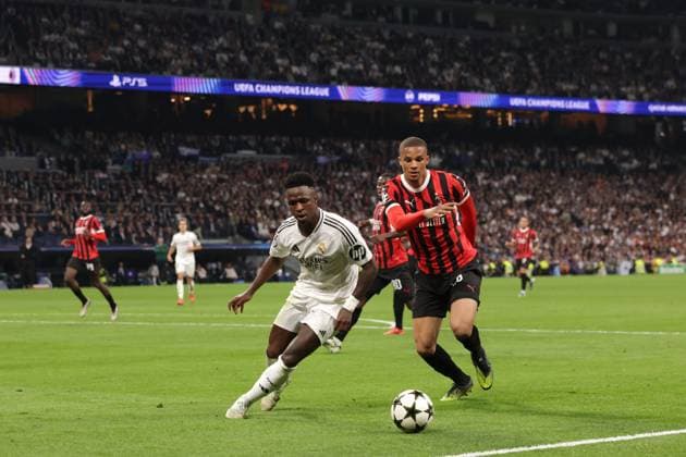 Madrid, Spain, 5th November 2024. Malick Thiaw of AC Milan tussles with Vinicius Junior of Real Madrid during the UEFA Champions League match at the Santiago Bernabau, Madrid. Picture credit should read: Jonathan Moscrop Sportimage EDITORIAL USE ONLY. No use with unauthorised audio, video, data, fixture lists, club league logos or live services. Online in-match use limited to 120 images, no video emulation. No use in betting, games or single club league player publications. SPI-3425-0060