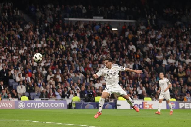 Madrid, Spain, 5th November 2024. Brahim Diaz of Real Madrid heads goalwards only for his effort to be weel saved by Mike Maignan of AC Milan during the UEFA Champions League match at the Santiago Bernabau, Madrid. Picture credit should read: Jonathan Moscrop Sportimage EDITORIAL USE ONLY. No use with unauthorised audio, video, data, fixture lists, club league logos or live services. Online in-match use limited to 120 images, no video emulation. No use in betting, games or single club league player publications. SPI-3425-0063