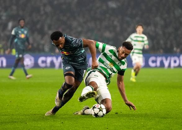 Loïs Openda of RB Leipzig challenges for the ball with Auston Trusty of Celtic. Celtic v RB Leipzig, UEFA Champions League, Group Stage, Football, Celtic Park, Glasgow, Scotland, UK - 05 Nov 2024 EDITORIAL USE ONLY No use with unauthorised audio, video, data, fixture lists, club league logos or live services. Online in-match use limited to 120 images, no video emulation. No use in betting, games or single club league player publications. Copyright: xStuartxWallace Shutterstockx 14863772dd