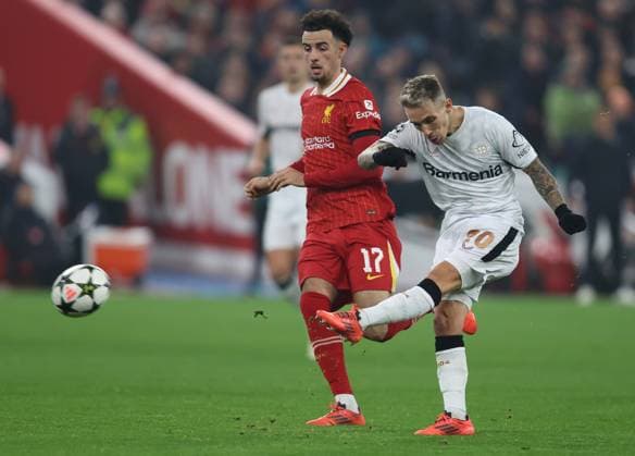 - Liverpool v Bayer 04 Leverkusen, UEFA Champions League, League Phase, Anfield Stadium, Liverpool, UK - 5th November 2024. Daniel Weir Crystal Pix Alex Grimaldo of Bayer Leverkusen has a shot on goal. - Liverpool v Bayer 04 Leverkusen, UEFA Champions League, League Phase, Anfield Stadium, Liverpool, UK - 5th November 2024. Daniel Weir Crystal Pix Liverpool Anfield Stadium UK Copyright: xDanxWeirx CP_Liverpool_Bayer_04_Leverkusen_64