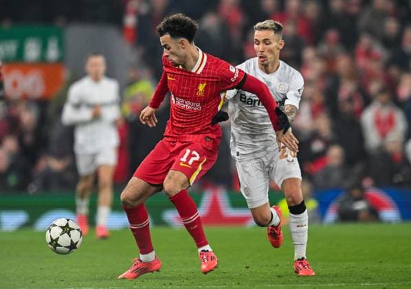 Liverpool v Bayer Leverkusen UEFA Champions League Curtis Jones of Liverpool and Alejandro Grimaldo of Bayern Leverkusen during the UEFA Champions League match at Anfield, Liverpool UK Newspapers OUT Copyright: xKarlxVallantinex FIL-20882-0045