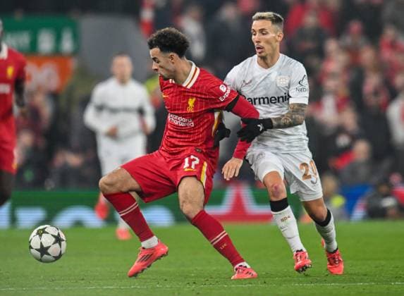 Liverpool v Bayer Leverkusen UEFA Champions League Curtins Jones of Liverpool and Alejandro Grimaldo of Bayern Leverkusen during the UEFA Champions League match at Anfield, Liverpool UK Newspapers OUT Copyright: xKarlxVallantinex FIL-20882-0061