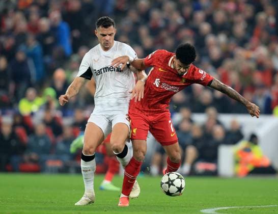 5th November 2024; Anfield, Liverpool, Merseyside, England; Champions League Football, Liverpool versus Bayer Leverkusen; Piero Hincapie of Bayer Leverkusen competes for the ball with Luis Diaz of Liverpool  ActionPlus12712516 DavidxBlunsden