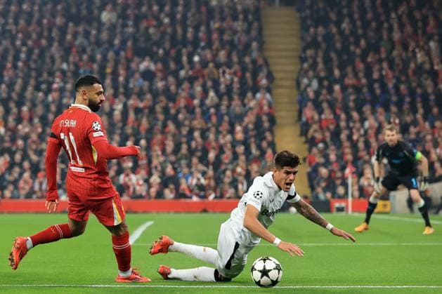 5th November 2024; Anfield, Liverpool, Merseyside, England; Champions League Football, Liverpool versus Bayer Leverkusen; Piero Hincapie of Bayer Leverkusen is fouled by Mohammed Salah of Liverpool  ActionPlus12712528 DavidxBlunsden