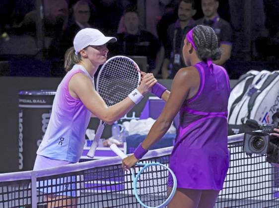 (241106) -- RIYADH, Nov. 6, 2024 -- Iga Swiatek of Poland (L) greets Coco Gauff of the United States after their round robin match at WTA, Tennis Damen Finals tennis tournament in Riyadh, Saudi Arabia, Nov. 5, 2024. ) (SP)SAUDI ARABIA-RIYADH-TENNIS-WTA FINALS-DAY 4 LuoxChen 
