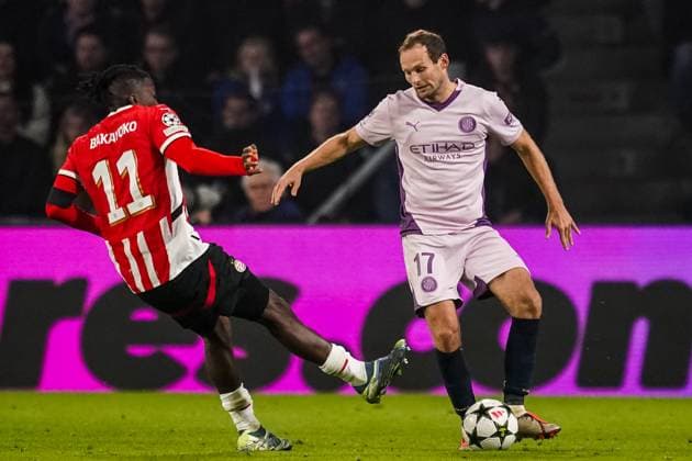 EINDHOVEN, NETHERLANDS - NOVEMBER 5: Johan Bakayoko of PSV challenges Daley Blind of Girona FC during the UEFA Champions League 2024 25 League Phase MD4 match between PSV Eindhoven and Girona FC at PSV Stadion on November 5, 2024 in Eindhoven, Netherlands. (Photo by Rene Nijhuis) SOC  Copyright: xRenexNijhuis