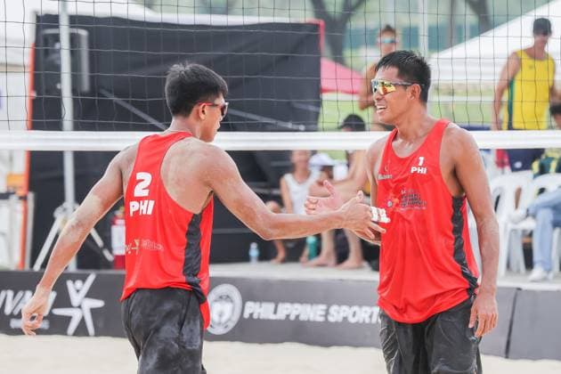 (241106) -- LAGUNA PROVINCE, Nov. 6, 2024 -- Alnakran Abdilla (R) and James Buytrago of the Philippines celebrate after scoring a point during the men s pool F match between Alani Nicklin Thomas Hartles of New Zealand and Alnakran Abdilla James Buytrago of the Philippines at the Asian Volleyball Confederation (AVC) 2024 Asian Senior Beach volleyball, Beachvolleyball Championships in Laguna Province, the Philippines, on Nov. 6, 2024. ) (SP)PHILIPPINES-LAGUNA PROVINCE-AVC 2024 ASIAN SENIOR BEACH VOLLEYBALL CHAMPIONSHIPS RouellexUmali 
