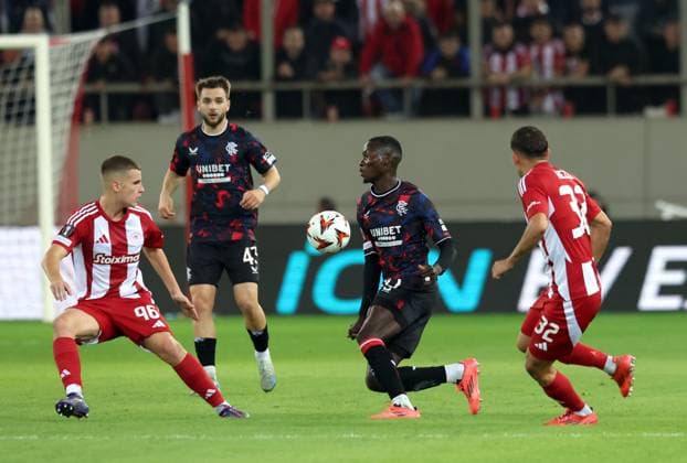 Santiago Hezze and Christos Mouzakitis of Olympiacos and Mohamed Diomande and Nicolas Raskin of Rangers during the Europa League group phase match at the Stadio Georgios Karaiskakis, Athens. Olympiakos v Rangers, UEFA Europa League, Group Stage, Football, Georgios Karaiskakis Stadium, Pireas, Greece - 07 Nov 2024 EDITORIAL USE ONLY No use with unauthorised audio, video, data, fixture lists, club league logos or live services. Online in-match use limited to 120 images, no video emulation. No use in betting, games or single club league player publications. Copyright: xLukexNickerson RangersxFC Shutterstockx 14878765cv