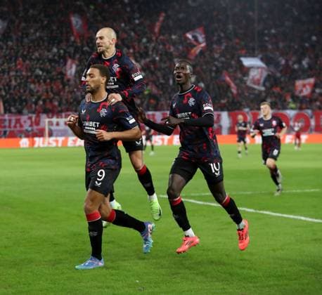 Cyriel Dessers of Rangers celebrates his goal with Vaclav Cerny and Mohamed Diomande during the UEFA Europa League league phase match at Georgios Karaiskakis Football Stadium, Athens. Olympiakos v Rangers, UEFA Europa League, Group Stage, Football, Georgios Karaiskakis Stadium, Pireas, Greece - 07 Nov 2024 EDITORIAL USE ONLY No use with unauthorised audio, video, data, fixture lists, club league logos or live services. Online in-match use limited to 120 images, no video emulation. No use in betting, games or single club league player publications. Copyright: xLukexNickerson RangersxFC Shutterstockx 14878765es