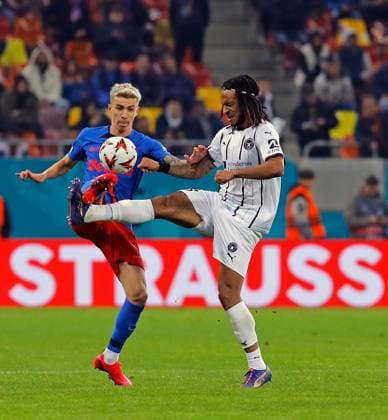 (241108) -- BUCHAREST, Nov. 8, 2024 -- FCSB s Octavian Popescu (L) vies with Midtjylland s Kevin Mbabu during a UEFA Europa League match between FCSB and Midtjylland in Bucharest, Romania, Nov. 7, 2024. (Photo by Xinhua) (SP)ROMANIA-BUCHAREST-UEFA EUROPA LEAGUE-FCSB VS FC MIDTJYLLAND CristianxCristel 