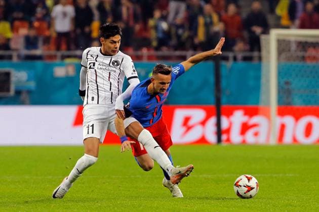 (241108) -- BUCHAREST, Nov. 8, 2024 -- FCSB s Marius Stefanescu (R) vies with Midtjylland s Dario Osorio during a UEFA Europa League match between FCSB and Midtjylland in Bucharest, Romania, Nov. 7, 2024. (Photo by Xinhua) (SP)ROMANIA-BUCHAREST-UEFA EUROPA LEAGUE-FCSB VS FC MIDTJYLLAND CristianxCristel 
