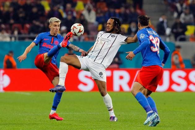 (241108) -- BUCHAREST, Nov. 8, 2024 -- FCSB s Octavian Popescu (L) and Risto Radunovic (R) vie with Midtjylland s Kevin Mbabu during a UEFA Europa League match between FCSB and Midtjylland in Bucharest, Romania, Nov. 7, 2024. (Photo by Xinhua) (SP)ROMANIA-BUCHAREST-UEFA EUROPA LEAGUE-FCSB VS FC MIDTJYLLAND CristianxCristel 
