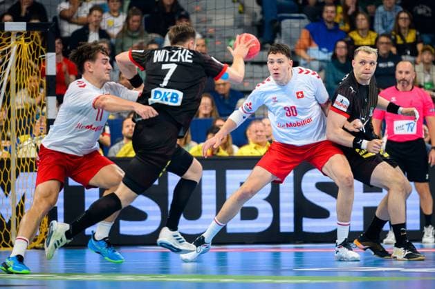 European Handball Championship Qualification, Germany Switzerland, 2 Qualification Round, Group 7, 1 Matchday, from left Felix Aellen Switzerland , Luca Witzke Germany , Joel Willecke Switzerland , Justus Fischer Germany Mannheim SAP Arena Baden Württemberg Germany