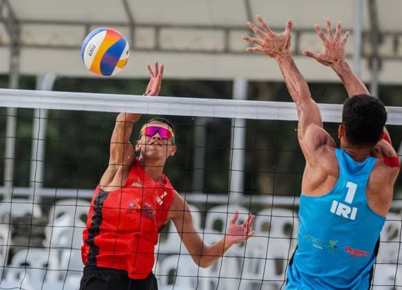 (241108) -- LAGUNA PROVINCE, Nov. 8, 2024 -- Habib Akbarzadeh Kashani (L) of Iran competes against Abbas Pourasgari of Iran during the men s round 16 match between Habib Akbarzadeh Kashani AmirAli GhalehNovi of Iran and Abbas Pourasgari Alireza Aghajanighasab of Iran at the Asian Volleyball Confederation (AVC) 2024 Asian Senior Beach volleyball, Beachvolleyball Championships in Laguna Province, the Philippines, on Nov. 8, 2024. ) (SP)PHILIPPINES-LAGUNA PROVINCE-AVC 2024 ASIAN SENIOR BEACH VOLLEYBALL CHAMPIONSHIPS RouellexUmali 