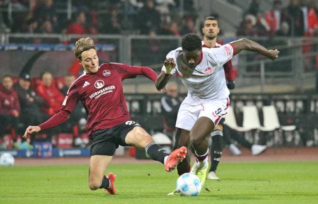 08 11 2024, xmohx, Fußball 2 Bundesliga, 1 FC Nuernberg 1 FC Kaiserslautern emspor, v l Caspar Jander Nürnberg , Ragnasr Ache Kaiserslautern DFL DFB REGULATIONS PROHIBIT ANY USE OF PHOTOGRAPHS as IMAGE SEQUENCES and or QUASI VIDEO Nuernberg