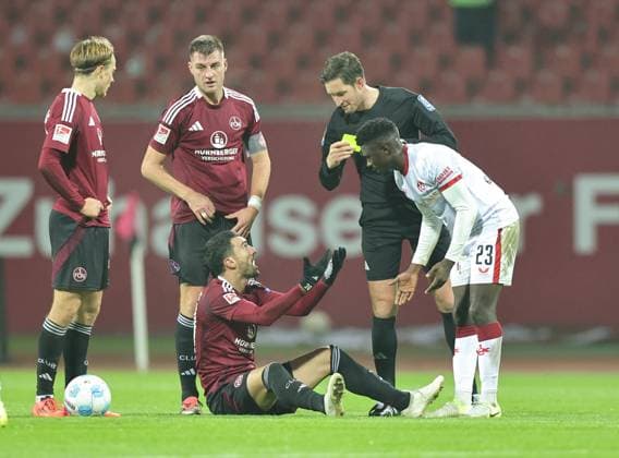 08 11 2024 Soccer Season 2024 2025 2 Soccer Bundesliga 12 Matchday 1 FC Nürnberg FCN Club 1 FC Kaiserslautern FCK Rote Roten Teufel Sportfoto Zink DaMa xdaxmax DFL regulations prohibit any use of photographs as image sequences and or quasi video only for editorial use Afeez Aremu 23, 1 FC Kaiserslautern FCK sees yellow card from Matthias Jöllenbeck referee after foul on Mahir Emreli 30, 1 FC Nürnberg FCN