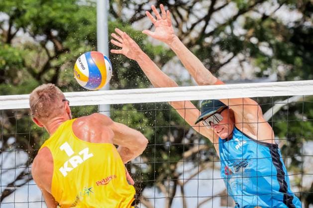 (241109) -- LAGUNA PROVINCE, Nov. 9, 2024 -- Dmitriy Yakovlev (L) of Kazakhstan competes against D Artagnan Potts of Australia during the men s quarterfinal between Dmitriy Yakovlev Sergey Bogatu of Kazakhstan and D Artagnan Potts Jack Pearse of Australia at the Asian Volleyball Confederation (AVC) 2024 Asian Senior Beach volleyball, Beachvolleyball Championships in Laguna Province, the Philippines, on Nov. 9, 2024. ) (SP)PHILIPPINES-LAGUNA PROVINCE-AVC 2024 ASIAN SENIOR BEACH VOLLEYBALL CHAMPIONSHIPS ROUELLExUMALI 
