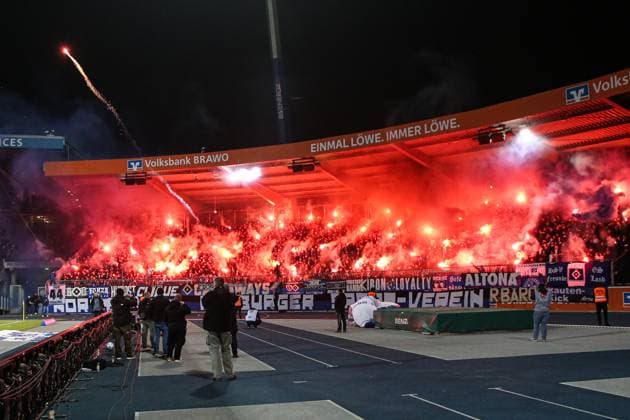 Fans of Hamburger SV shoot pyrotechnics on the pitch at the start of the match 2 Soccer Bundesliga season 2024 2025 Eintracht Braunschweig vs Hamburger SV at Eintracht Stadium in Braunschweig Action,Soccer,Man,Men,Germany,08 11 2024
