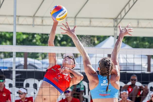(241109) -- LAGUNA PROVINCE, Nov. 9, 2024 -- Xue Chen (L) of China spikes the ball against Jana Milutinovic of Australia during women s semifinal match between Xue Chen Zeng Jinjin of China and Stefanie Fejes Jana Milutinovic of Australia at the Asian Volleyball Confederation (AVC) 2024 Asian Senior Beach volleyball, Beachvolleyball Championships in Laguna Province, the Philippines, Nov. 9, 2024. ) (SP)PHILIPPINES-LAGUNA PROVINCE-AVC 2024 ASIAN SENIOR BEACH VOLLEYBALL CHAMPIONSHIPS RouellexUmali 
