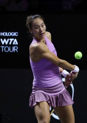 (241110) -- RIYADH, Nov. 10, 2024 -- Zheng Qinwen of China hits a return during the final match against Coco Gauff of the United States at WTA, Tennis Damen Finals tennis tournament in Riyadh, Saudi Arabia, Nov. 9, 2024. ) (SP)SAUDI ARABIA-RIYADH-TENNIS-WTA FINALS-FINAL WangxHaizhou 