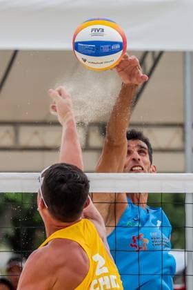 (241110) -- LAGUNA PROVINCE, Nov. 10, 2024 -- Halikejiang (L) of China attempts a block as Abbas Pourasgari of Iran spikes the ball during the men s bronze medal match between Abbas Pourasgari Alireza Aghajanighasab of Iran and Wu Jiaxin Halikejiang of China at the Asian Volleyball Confederation (AVC) 2024 Asian Senior Beach volleyball, Beachvolleyball Championships in Laguna Province, the Philippines, Nov. 10, 2024. ) (SP)PHILIPPINES-LAGUNA PROVINCE-AVC 2024 ASIAN SENIOR BEACH VOLLEYBALL CHAMPIONSHIPS-FINALS RouellexUmali 