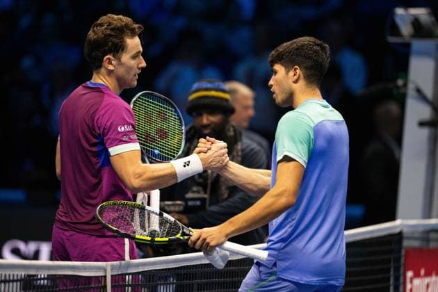 Norway s Casper Ruud shakes hands to Spain s Carlos Alcaraz after& xa0;their singles tennis match of the ATP, Tennis Herren World Tour Finals at the Inalpi Arena, in Turin, Italy - - Monday, November 11, 2024.  Copyright: xMarcoxAlpozzi LaPressex