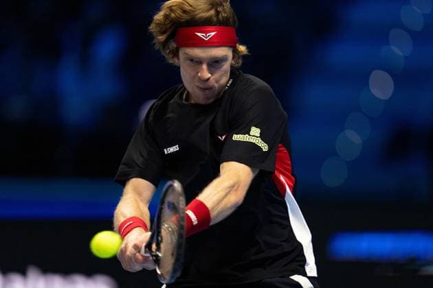 Russia s Andrey Rublev& xa0;returns the ball to Spain s Carlos Alcaraz & xa0;during& xa0;their singles tennis match of the ATP, Tennis Herren World Tour Finals at the Inalpi Arena, in Turin, Italy - - Wednesday, November 13, 2024.  Copyright: xMarcoxAlpozzi LaPressex