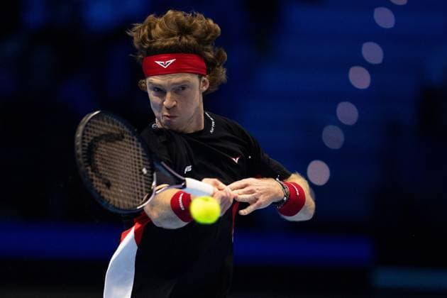 Russia s Andrey Rublev& xa0;returns the ball to Spain s Carlos Alcaraz & xa0;during& xa0;their singles tennis match of the ATP, Tennis Herren World Tour Finals at the Inalpi Arena, in Turin, Italy - - Wednesday, November 13, 2024.  Copyright: xMarcoxAlpozzi LaPressex