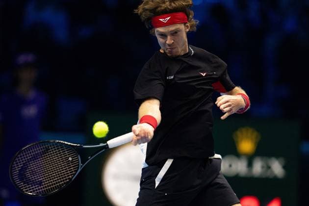 Russia s Andrey Rublev& xa0;returns the ball to Spain s Carlos Alcaraz & xa0;during& xa0;their singles tennis match of the ATP, Tennis Herren World Tour Finals at the Inalpi Arena, in Turin, Italy - - Wednesday, November 13, 2024.  Copyright: xMarcoxAlpozzi LaPressex