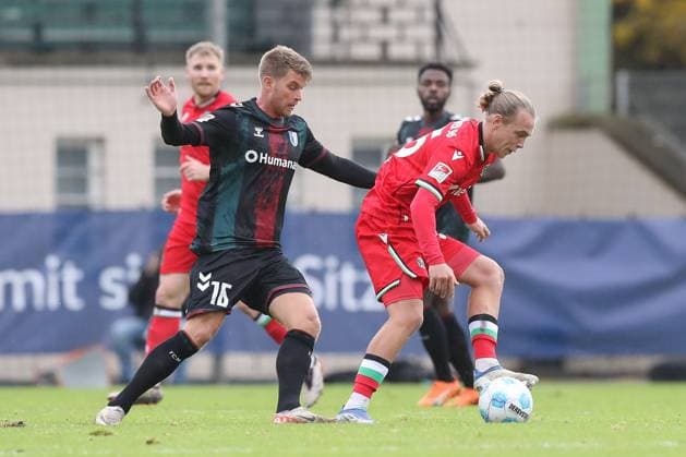 14.11.2024, xtgx, Fussball - Testspiel, Hannover 96 - 1.FC Magdeburg emspor, v.l. Marcus Mathisen (Magdeburg, 16), Lars Gindorf (Hannover, 25) Zweikampf, Duell, Kampf, tackle (DFL DFB REGULATIONS PROHIBIT ANY USE OF PHOTOGRAPHS as IMAGE SEQUENCES and or QUASI-VIDEO) Hannover