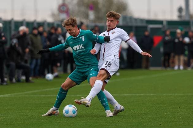 in duel, action, with Robert Gumny 2 FC Augsburg , Niclas Duehring 18 FC Ingolstadt 04 , FC Augsburg vs FC Ingostadt 04, Soccer, Test match, 14 11 2024 Augsburg Bayern Germany Copyright: xkolbert-press ChristianxKolbertx