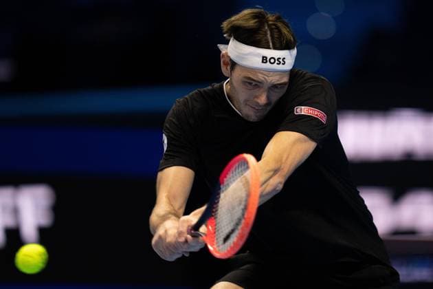 United States Taylor Fritz returns the ball to Australia s Alex de Minaur& xa0;during& xa0;their singles tennis match of the ATP, Tennis Herren World Tour Finals at the Inalpi Arena, in Turin, Italy - - Thursday, November 14, 2024.  Copyright: xMarcoxAlpozzi LaPressex