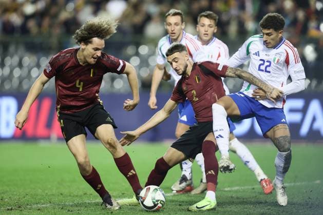 Belgium s Zeno Debast and Italian Giovanni Di Lorenzo fight for the ball during a soccer game between Belgian national soccer team Red Devils and Italy, match 5 (out of 6) in the League A Group 2 of the UEFA Nations League 2025 competition, Thursday 14 November 2024 in Brussels. BRUNOxFAHY  x105422784x