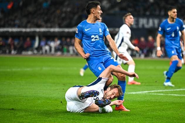 November 15, 2024, Athens, Athens, Greece: 9 HARRY KANE of England competes with 22 DIMITRIS GIANNOULIS of Greece during the UEFA Nations League 2024 25 League B, Group B2 match between Greece and England on November 14, 2024 at OAKA Stadium, in Athens, Greece. Athens Greece - ZUMAk160 20241115_zip_k160_006 Copyright: xStefanosxKyriazisx